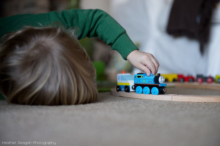 Playing with trains on the floor - Lake Oswego family photography