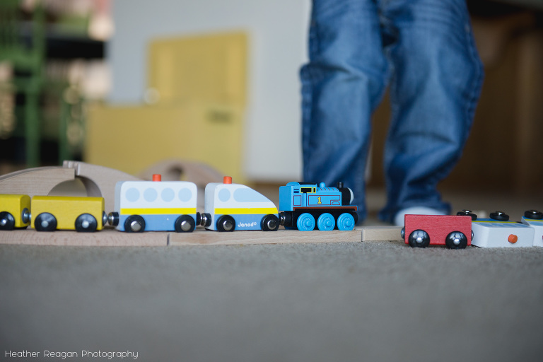 Standing with the toy train - Lake Oswego in-home family photography