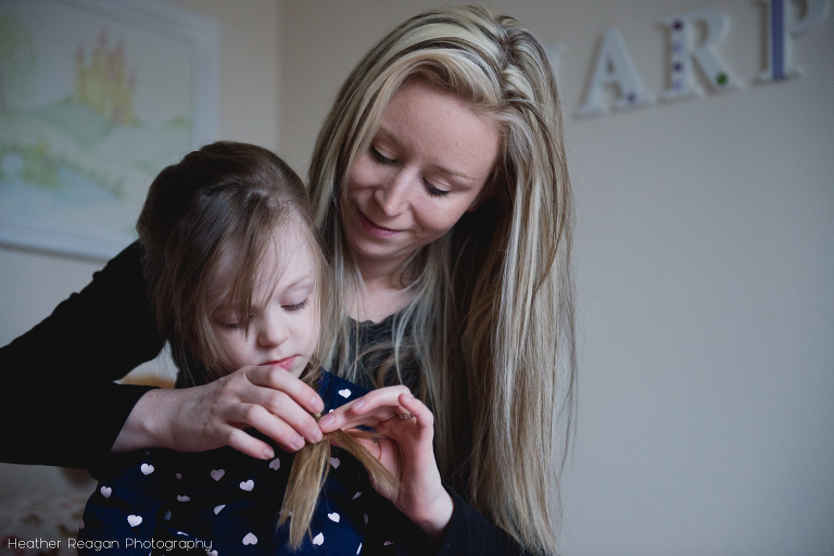 Mom doing daughter's hair - Oregon documentary family photography