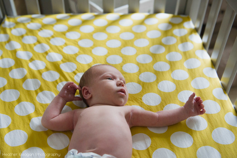 Newborn baby in crib - Portland lifestyle newborn photography